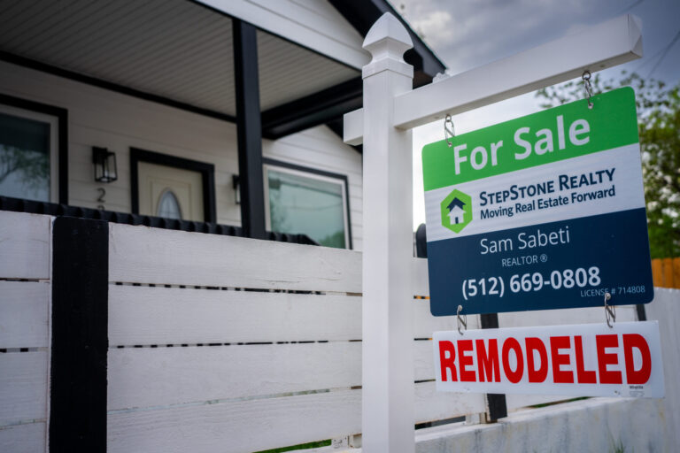 A for sale sign in front of a house in Austin, Texas